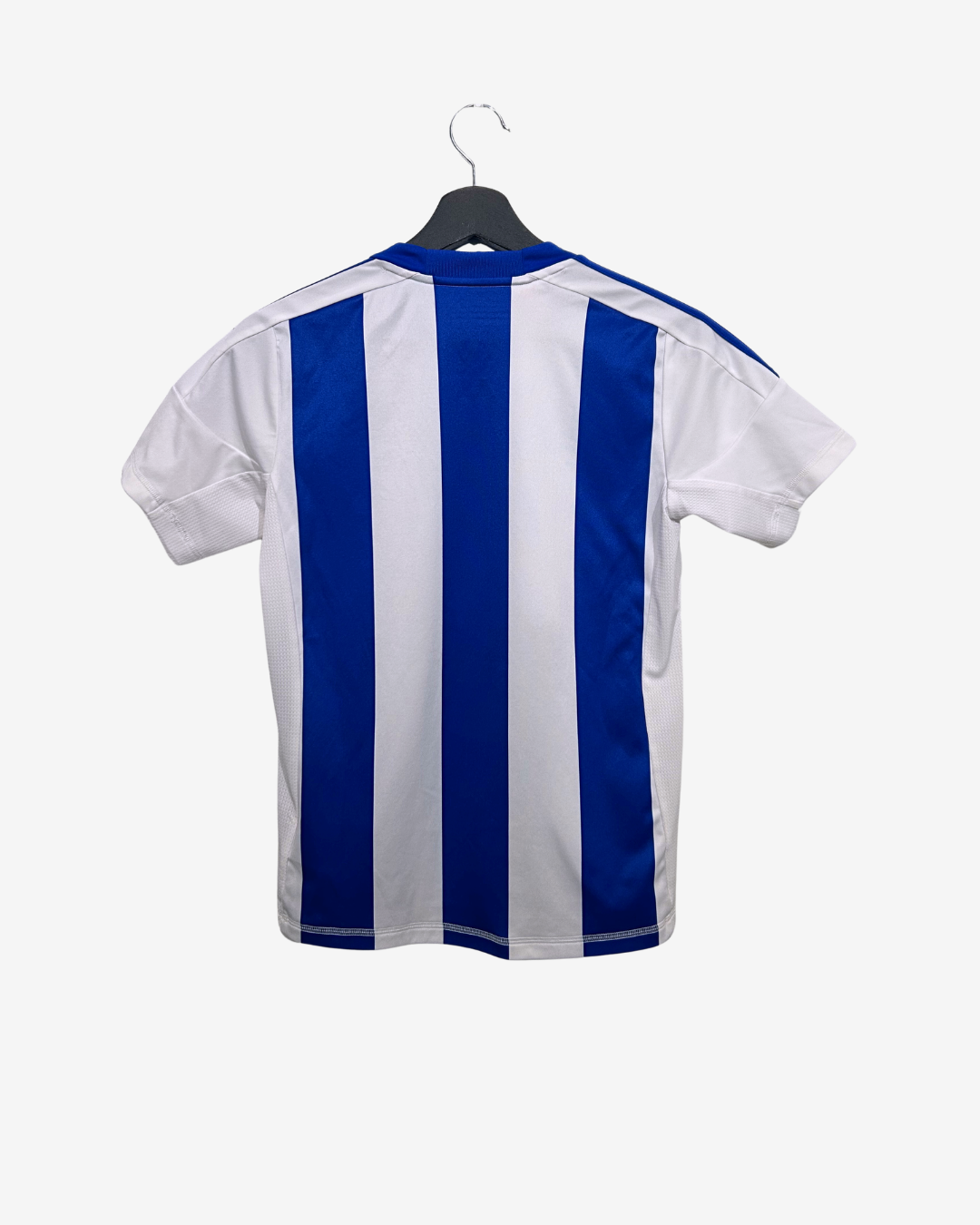 White and blue striped shirt on a hanger against a white background