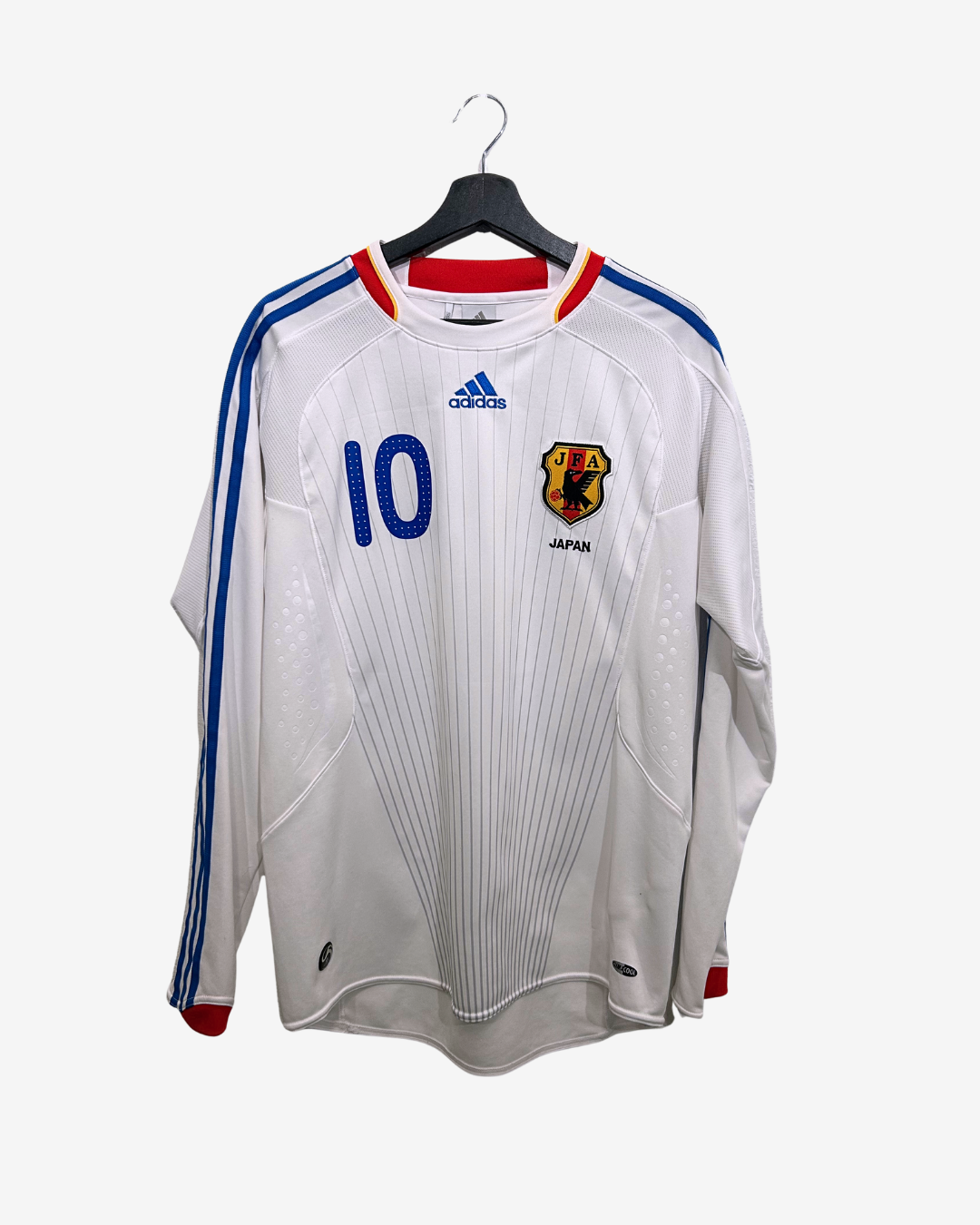 White sports jersey with blue and red accents on a hanger
