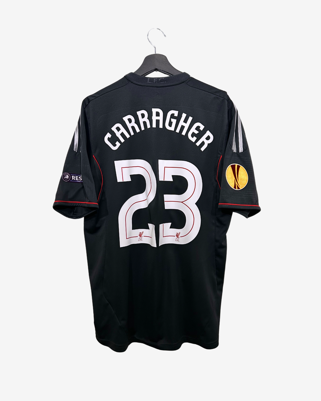Black sports jersey with 'Carragher' and number '23' on a white background