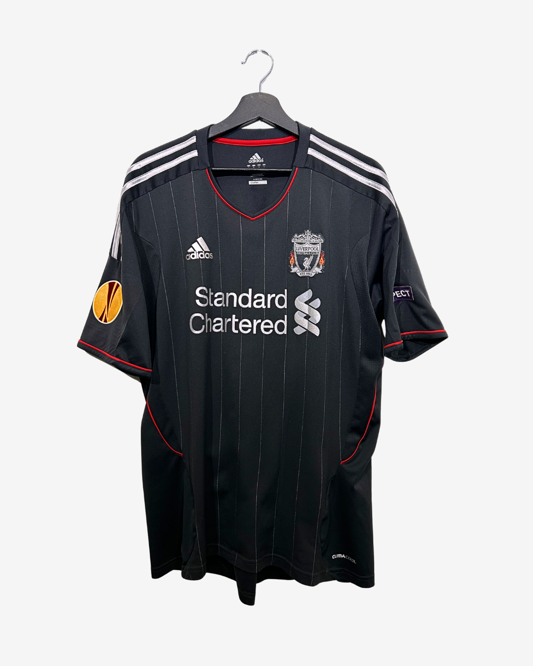 Black sports jersey with visible branding on a hanger against a white background
