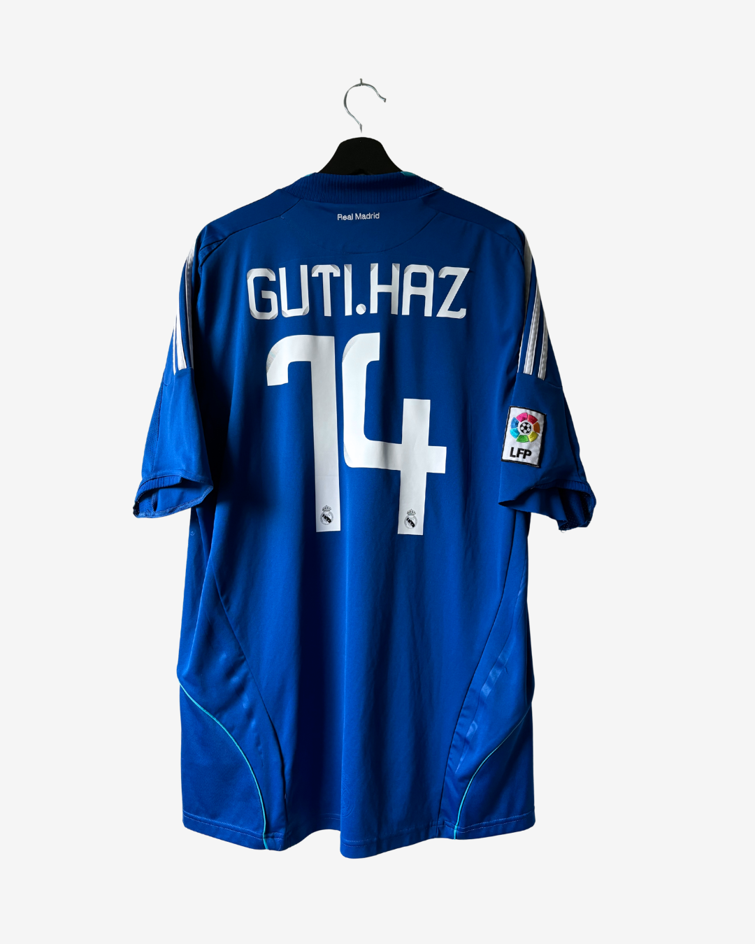 A royal blue FC Barcelona soccer jersey shown from the back, hanging on a black hanger against a light gray background. The back features the player name 'GUTIHAZ' and the number '14' in white, with the LaLiga patch on the right sleeve.