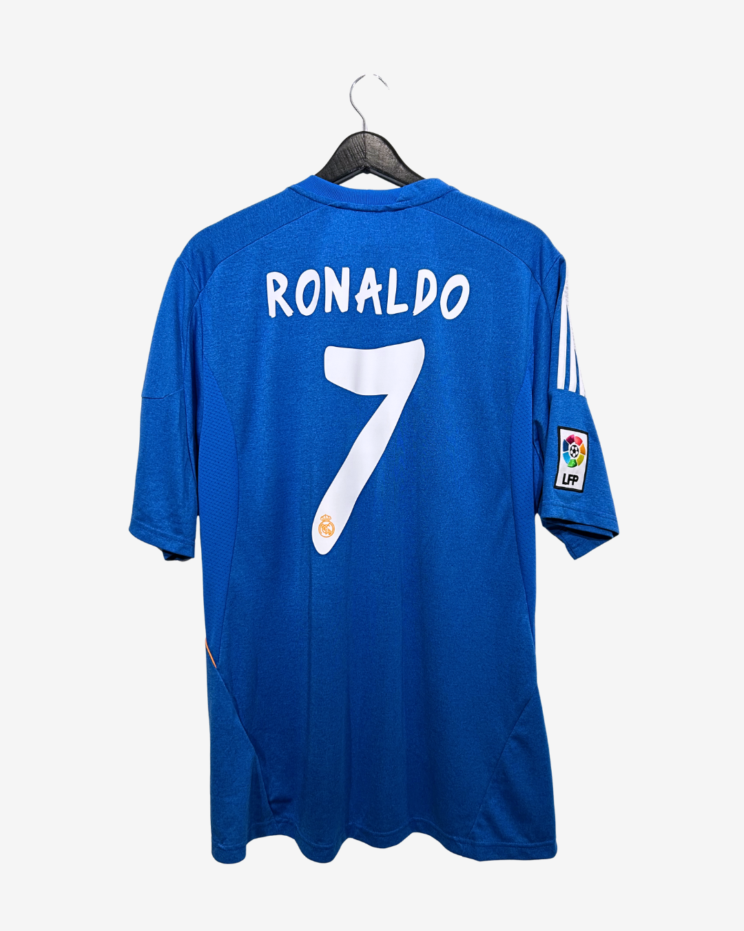 Blue sports jersey with 'RONALDO 7' on a hanger against a white background