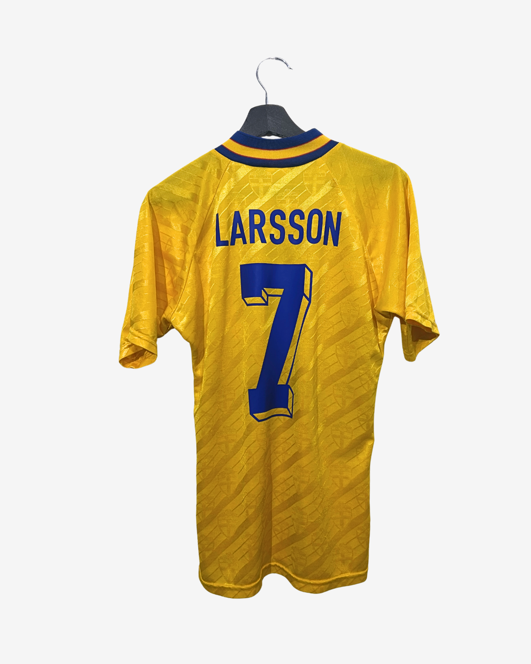 Yellow sports jersey with 'Larsson' and number '7' on a hanger against a white background
