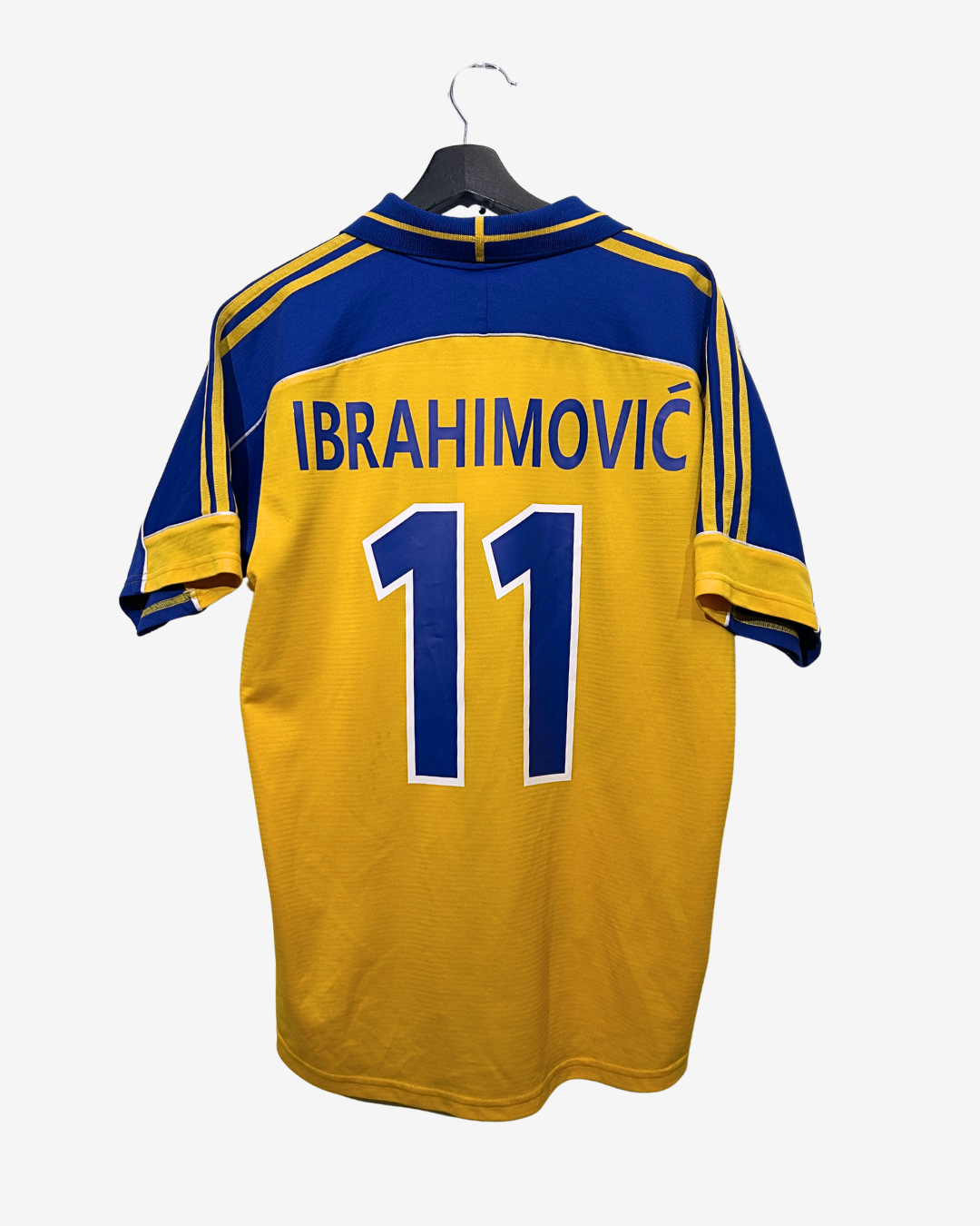 Yellow and blue sports jersey with 'Ibrahimovi|' and number '11' on a white background