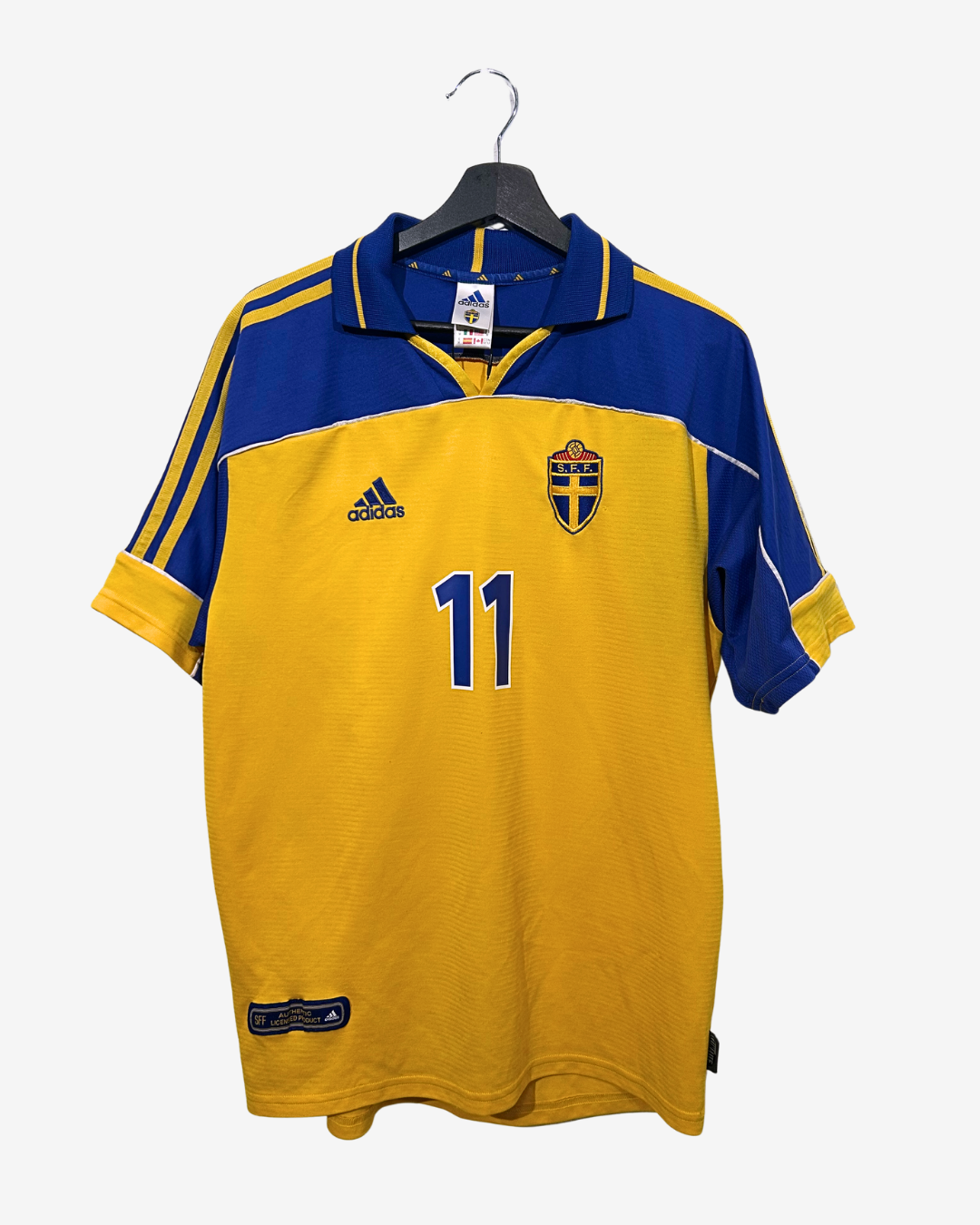 Yellow and blue sports jersey with number 11 on a hanger