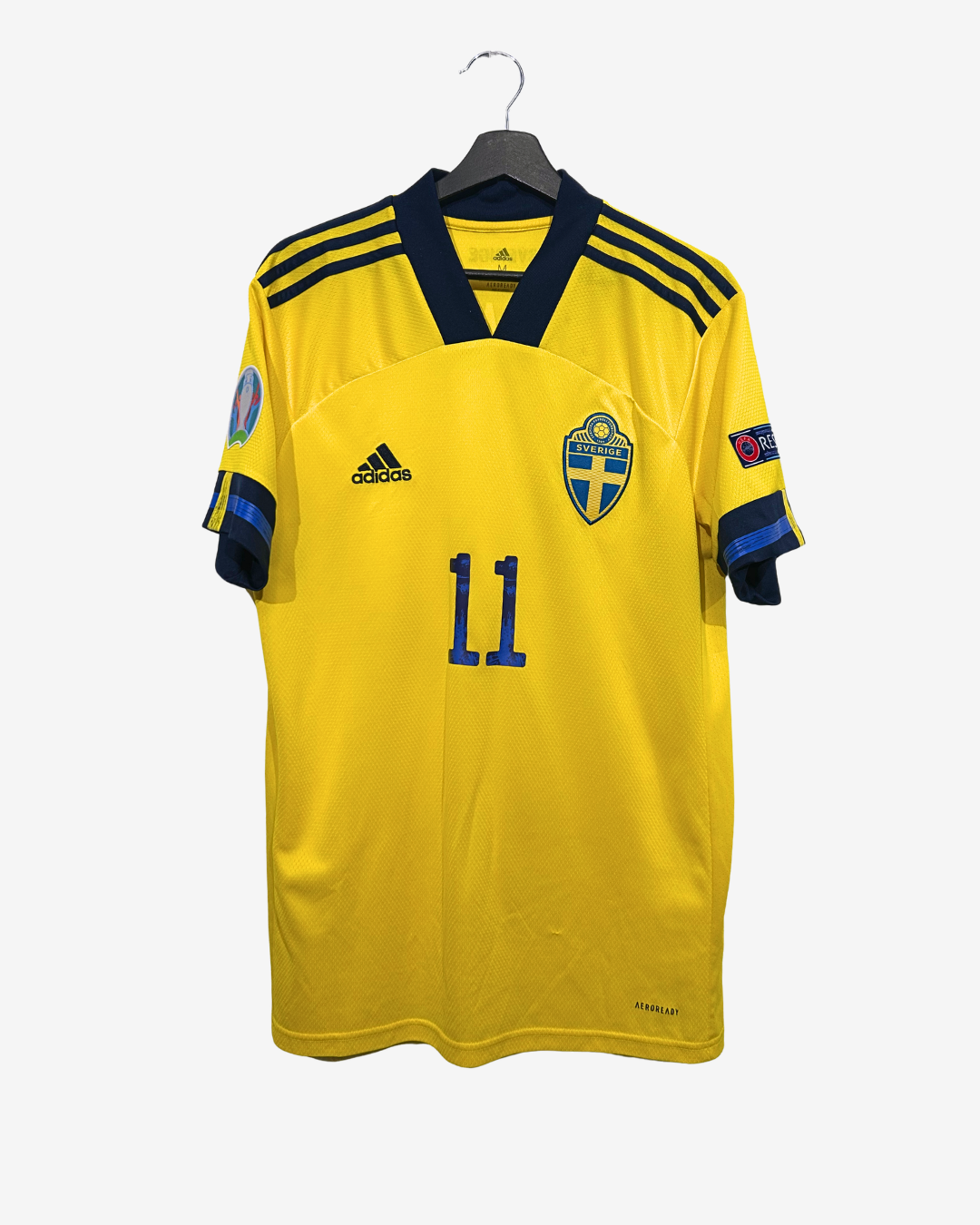Yellow soccer jersey with blue accents and number 11, Adidas logo visible, on a white background