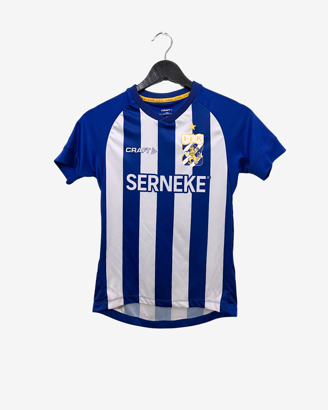 Blue and white striped sports jersey on a hanger with 'CRAFT' branding.