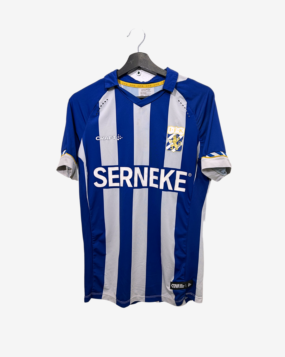 Blue and white striped sports jersey with 'SERNEKE' branding on a hanger against a white background