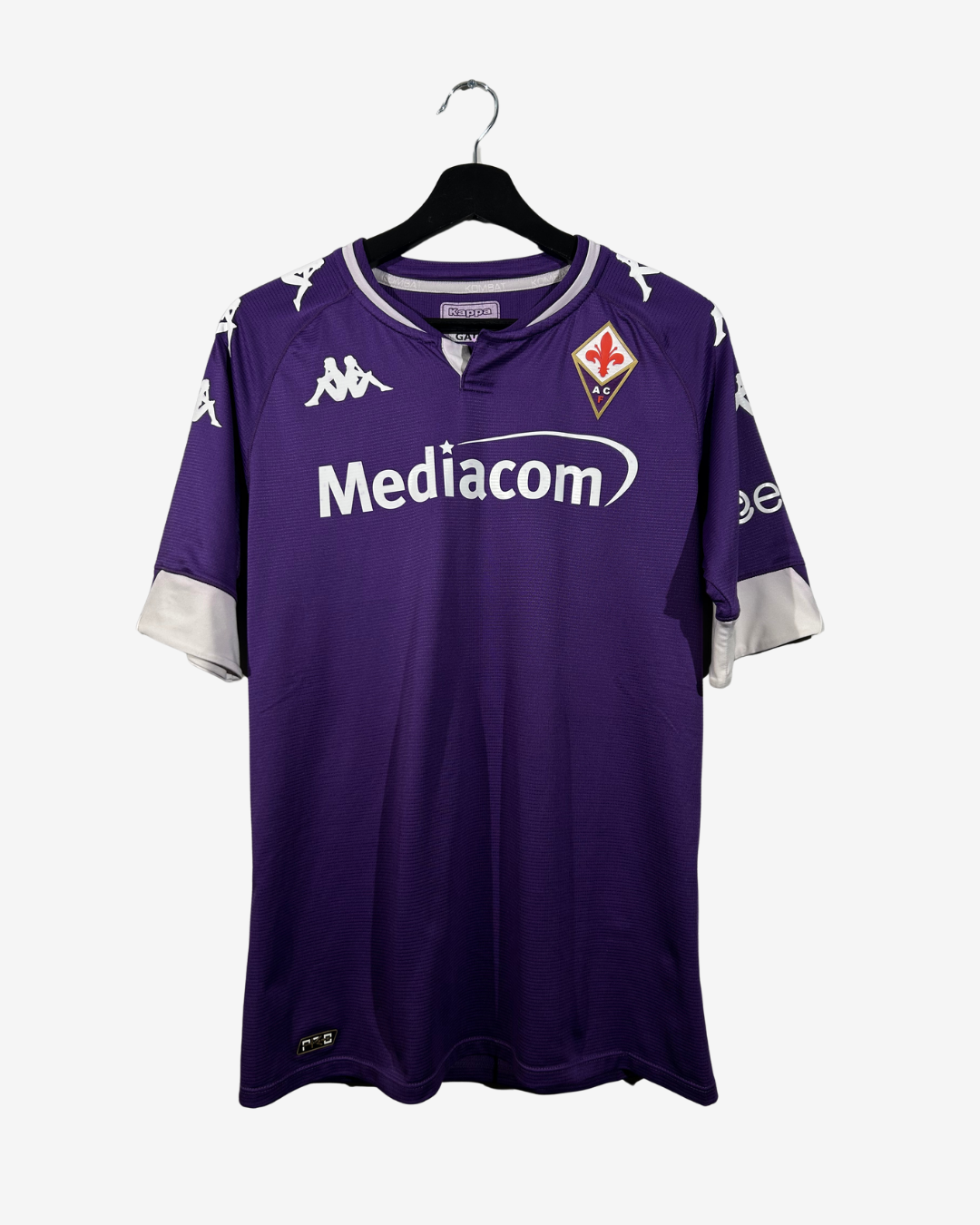 Purple sports jersey with 'Mediacom' logo on a hanger against a white background