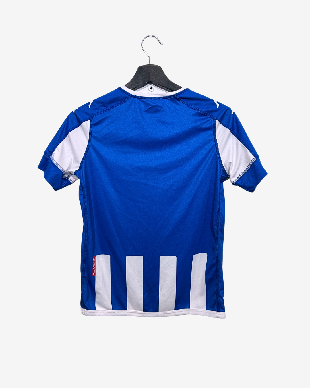 Blue sports jersey with white accents on a hanger against a white background