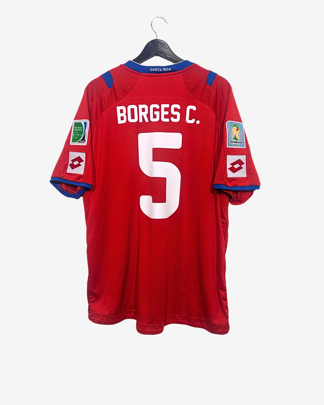 Red sports jersey with 'BORGES C.' and number '5' on a hanger against a white background