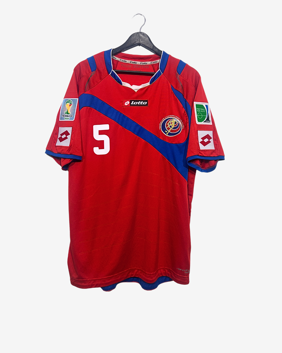 Red sports jersey with blue accents on a hanger against a white background