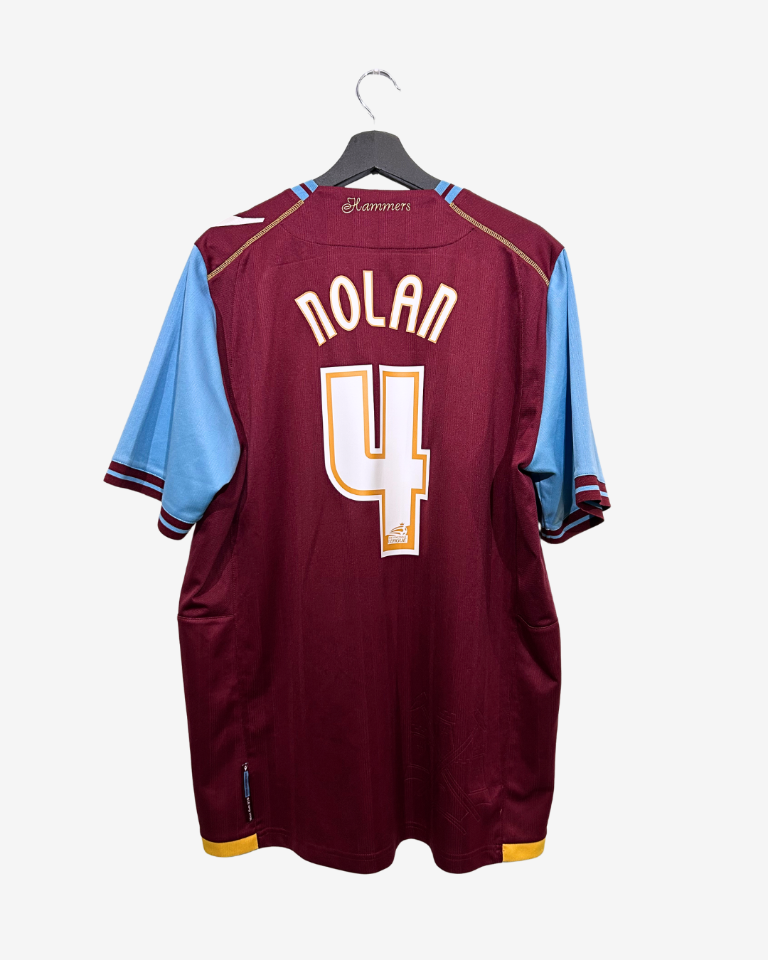 Maroon sports jersey with 'Nolan 4' on a hanger against a white background