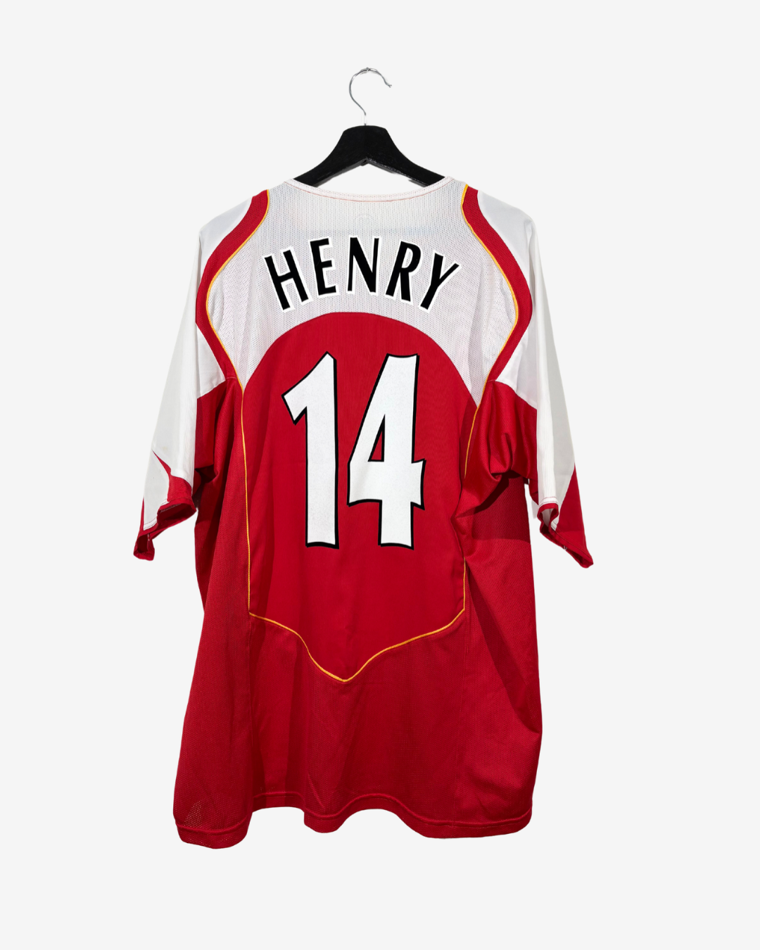 A red and white sports jersey hanging on a black hanger against a light gray background. The back of the jersey features the name 'HENRY' in black letters above the number '14' in white with a black outline.