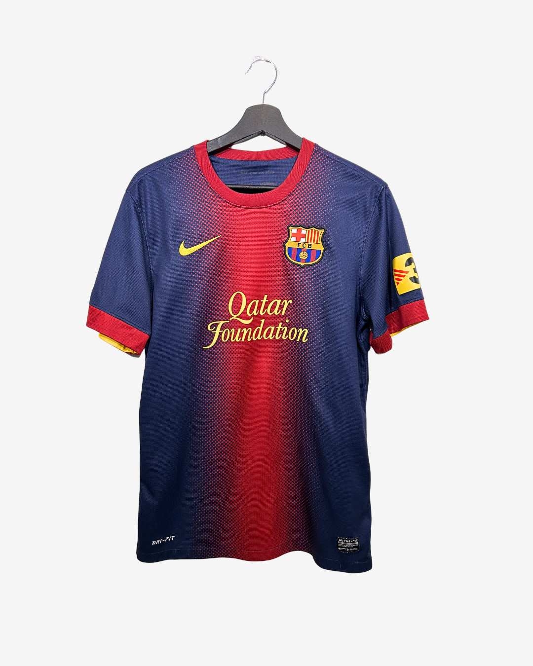 Blue and red sports jersey with Nike logo on a hanger