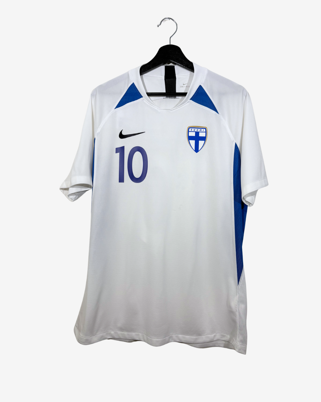 A white Nike Finland soccer jersey with blue accents, featuring the number 10 on the front, hanging on a black hanger against a light gray background.
