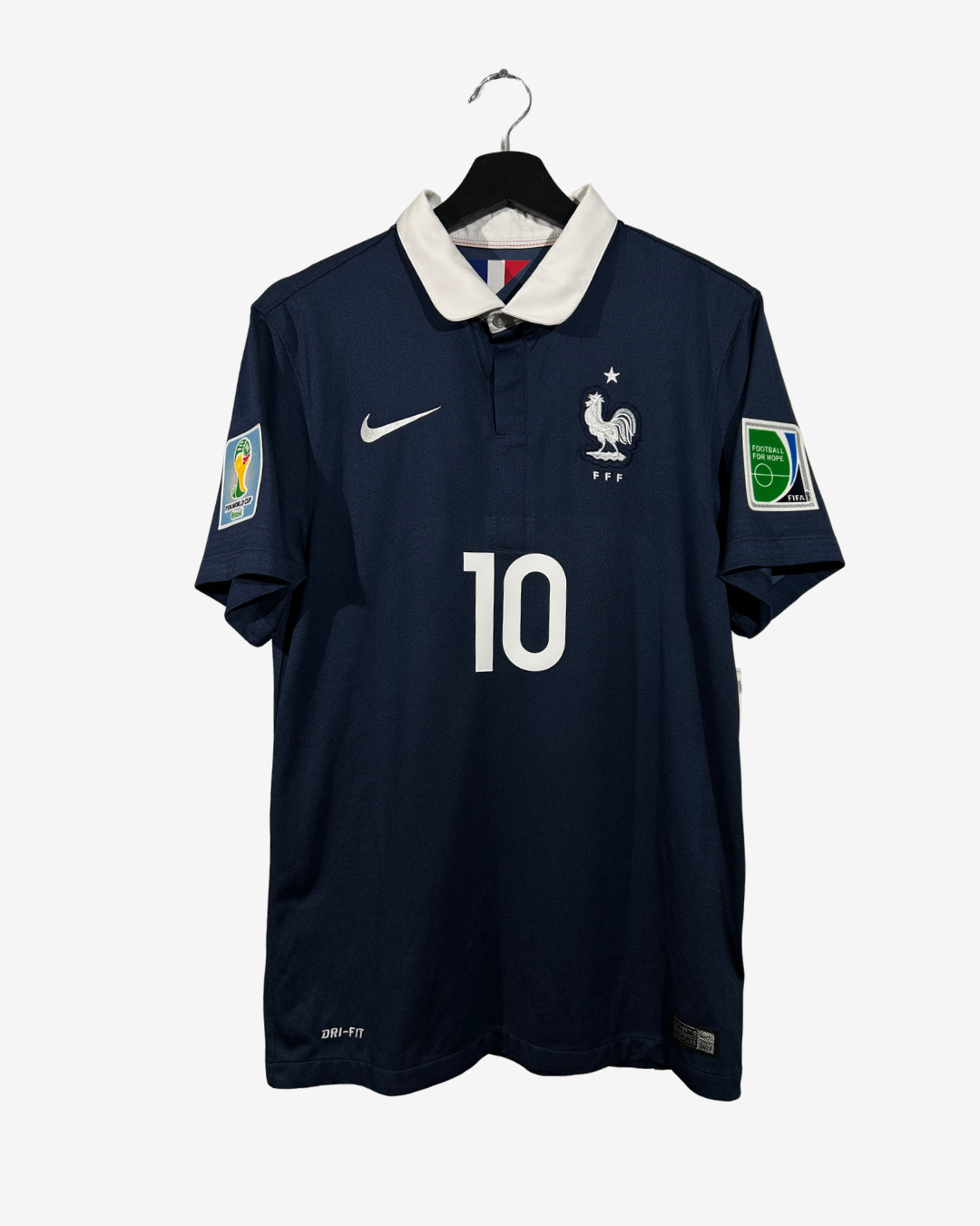 Navy blue soccer jersey with number 10 on a hanger against a white background