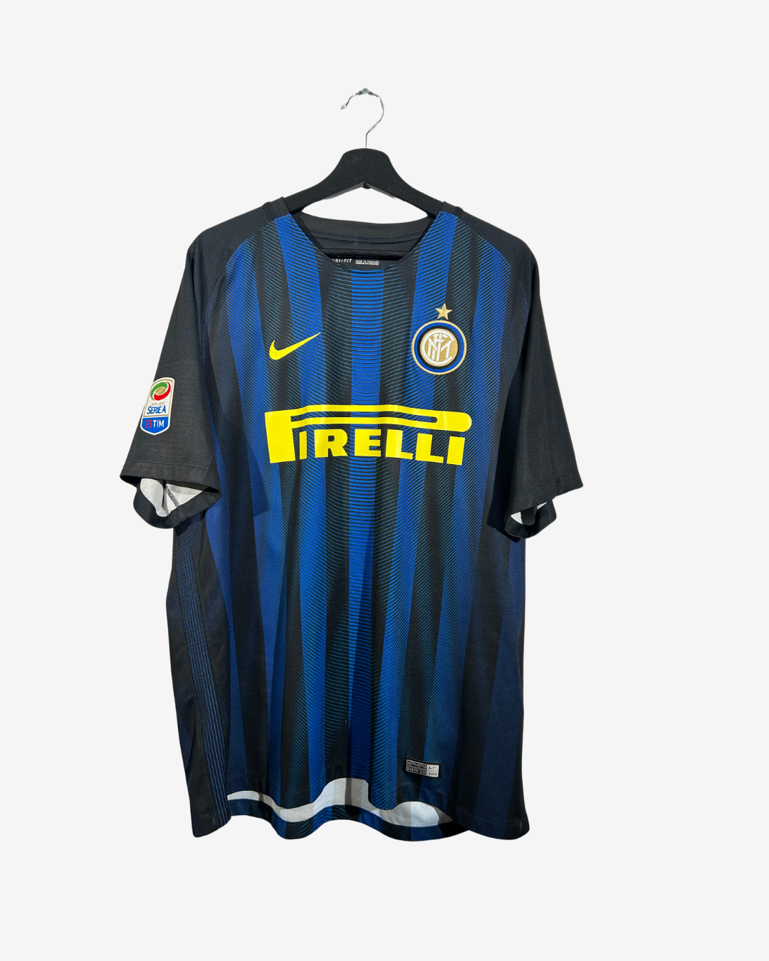 Inter Milan football jersey with Nike and Pirelli logos on a hanger against a white background