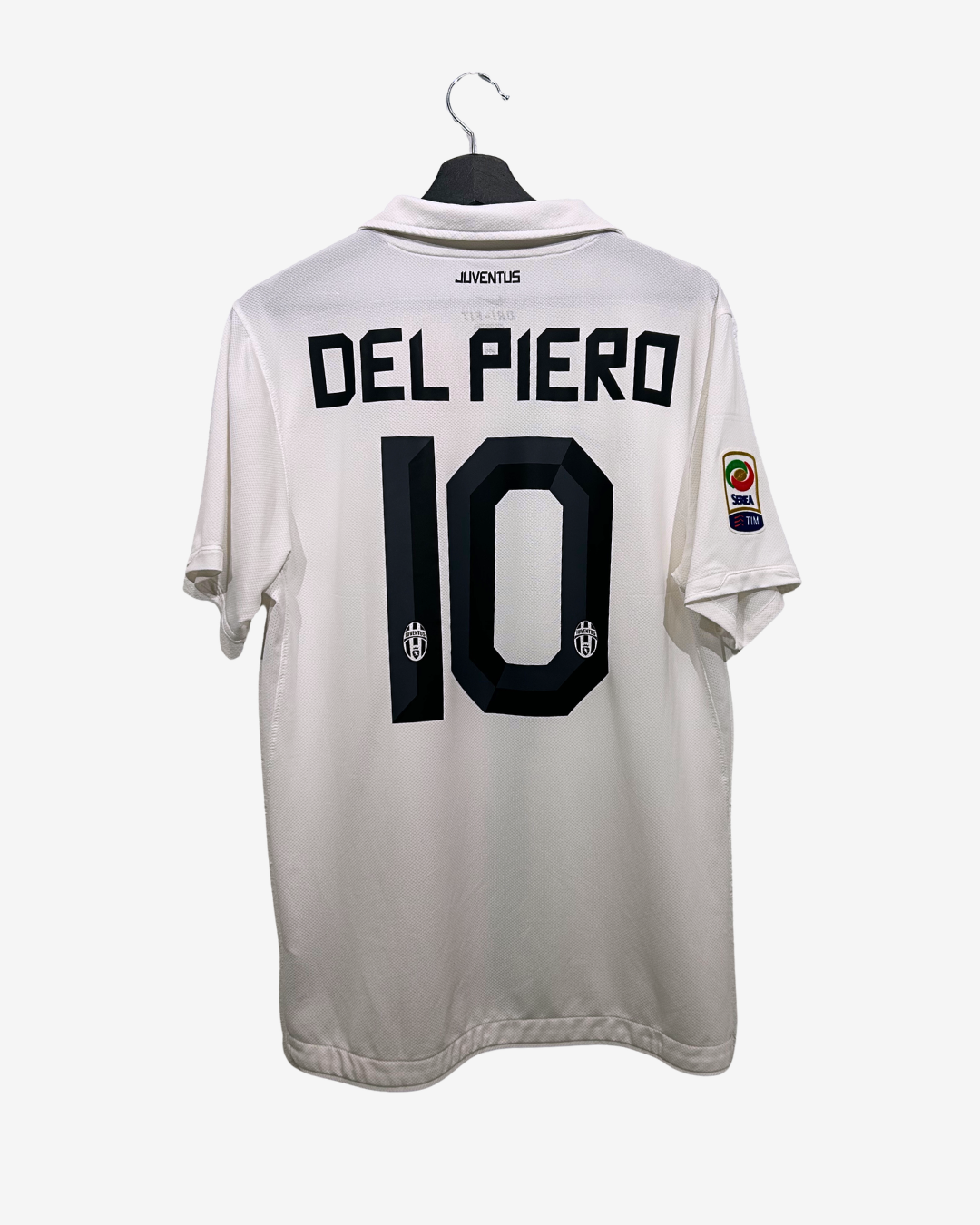 White sports jersey with 'Del Piero 10' on a hanger against a white background