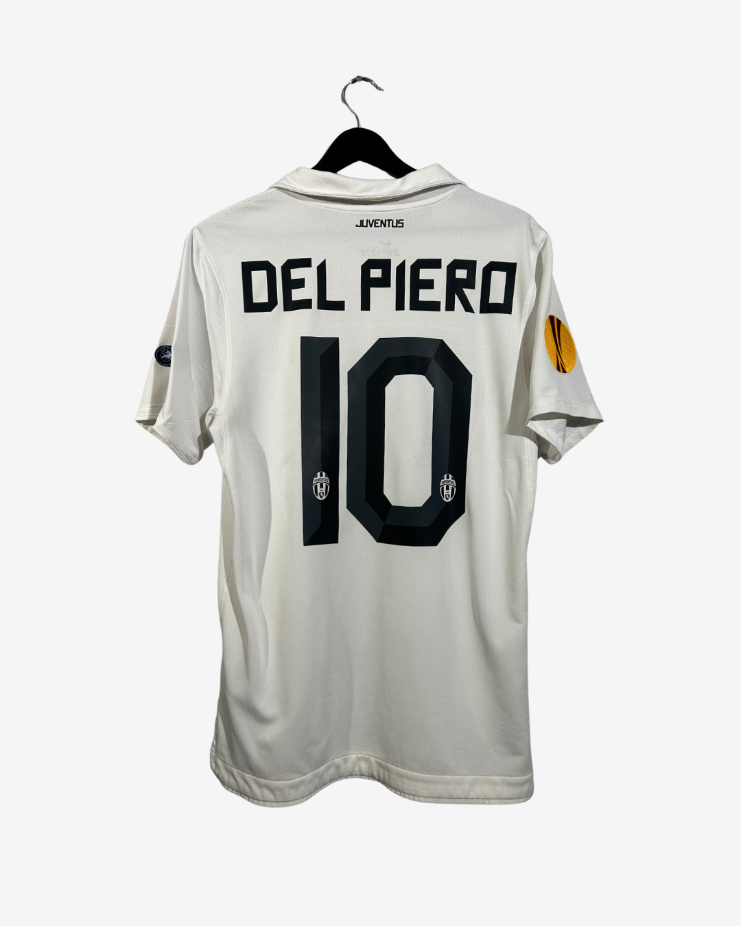 White sports jersey with 'Del Piero' and number '10' on a hanger against a white background