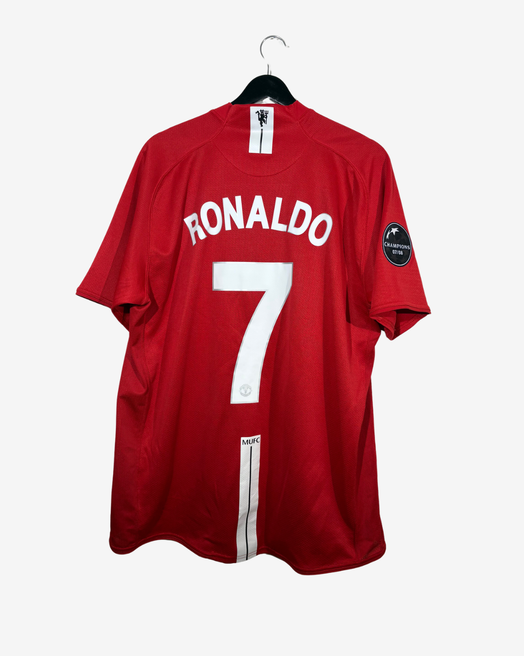 A red short-sleeve soccer jersey hanging on a black hanger against a light gray background. The back of the jersey features the name 'RONALDO' in white arched lettering above a large white number '7'.