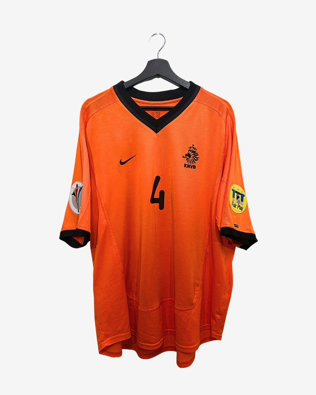 Orange sports jersey with black accents on a hanger against a white background