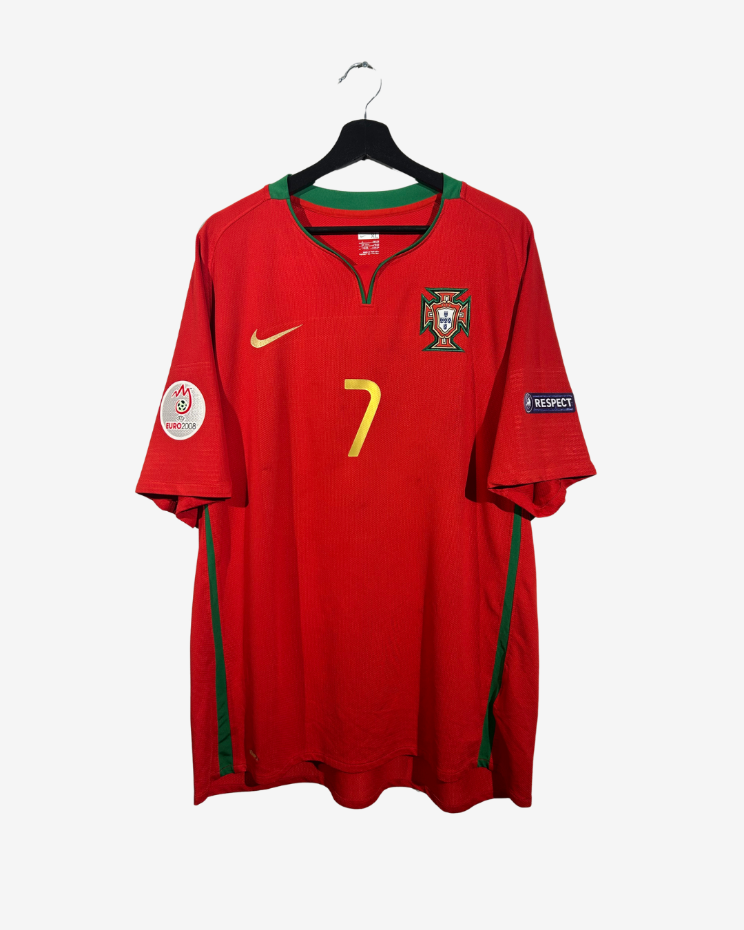 Red soccer jersey with number 7 on a hanger against a white background
