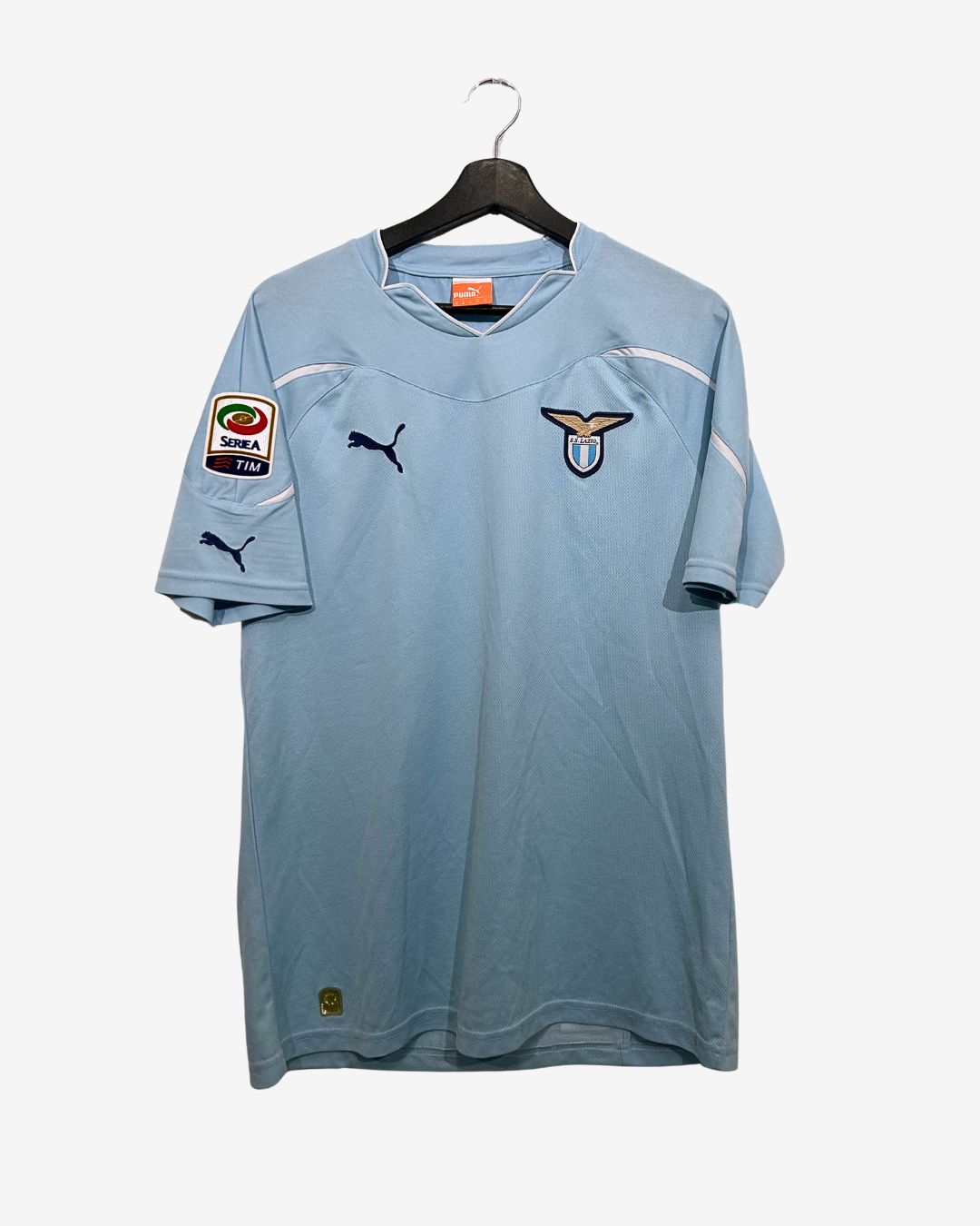 Light blue sports jersey with brand logos on a white background