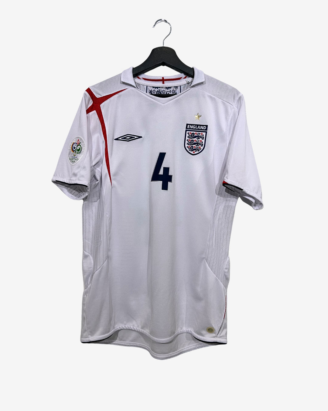White sports jersey with red and black accents on a hanger against a white background