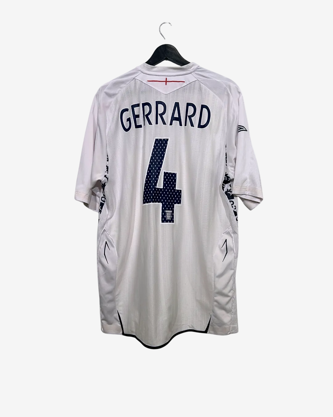 White sports jersey with 'Gerrard' and number '4' on a hanger against a white background