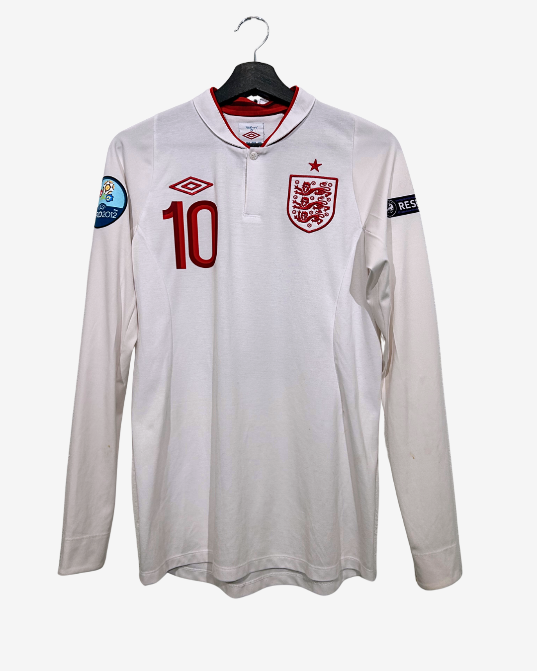 White long-sleeve shirt with red number 10 and England flag logo on a hanger