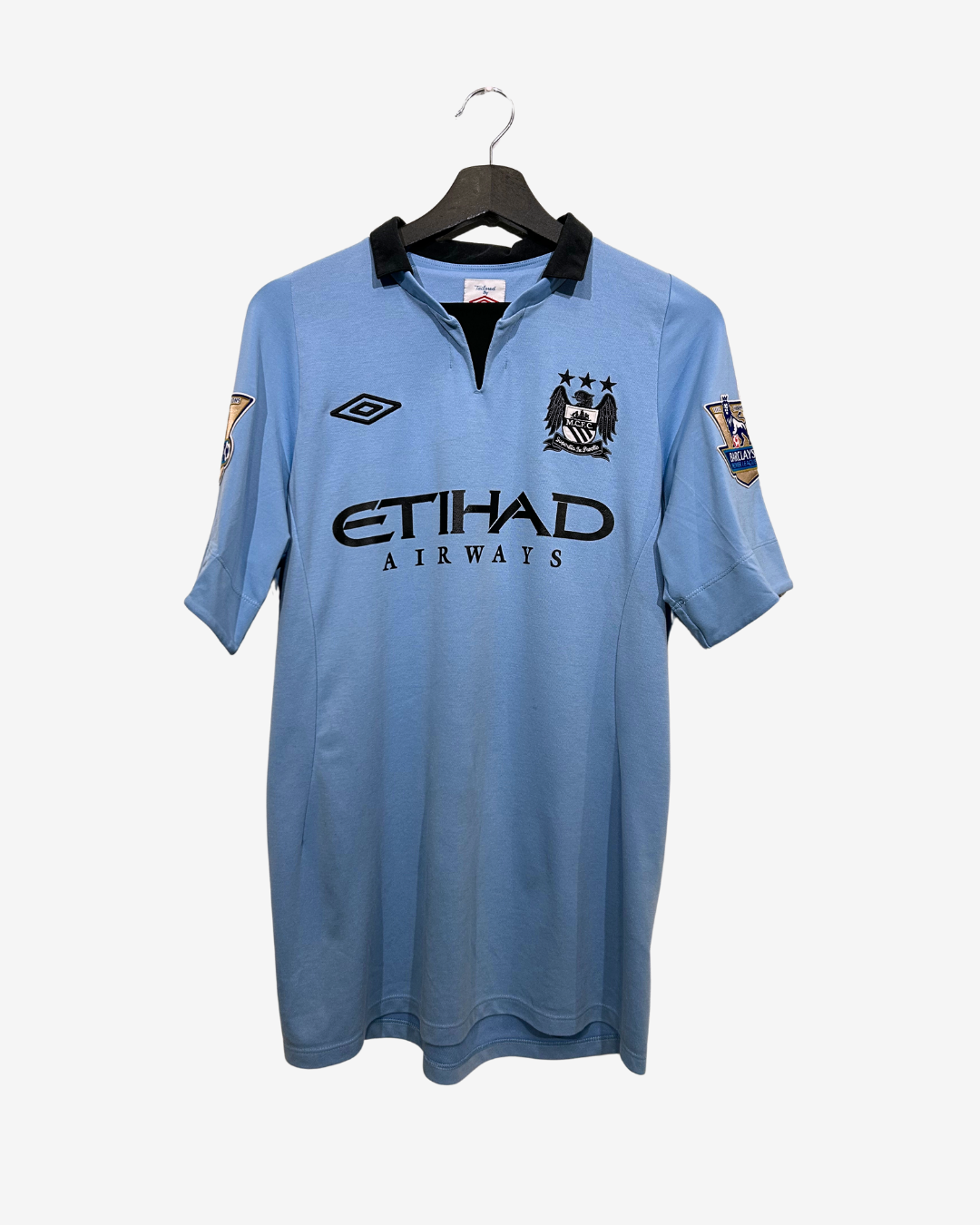 Blue sports jersey with brand logos on a white background