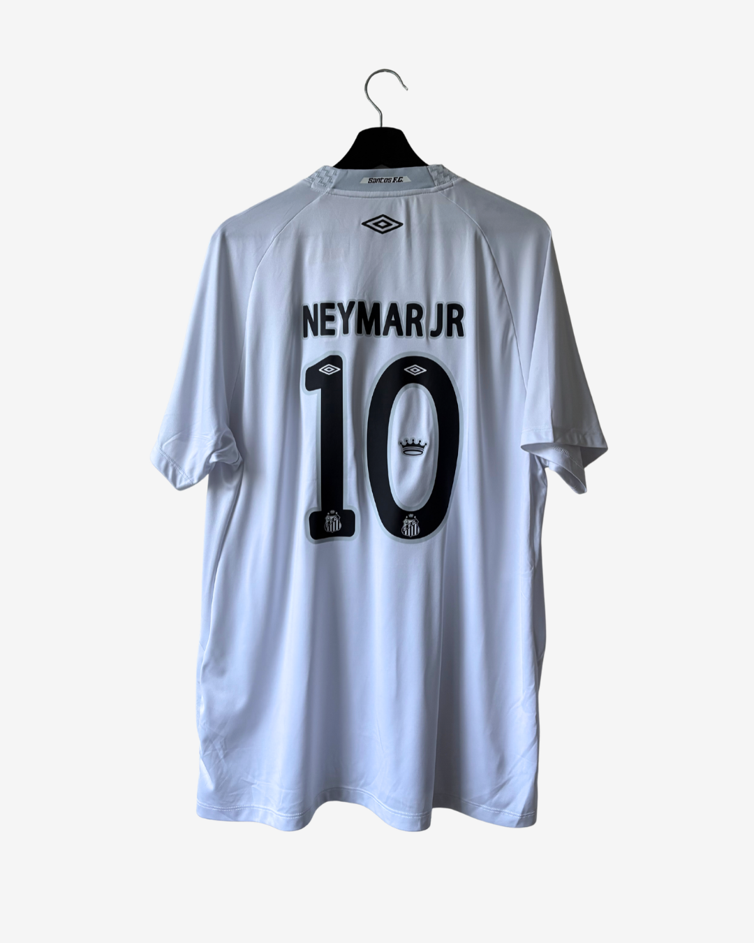 A white Umbro Neymar Jr. soccer jersey with the number 10 and name printed in black on the back, hanging on a black hanger against a light gray background.