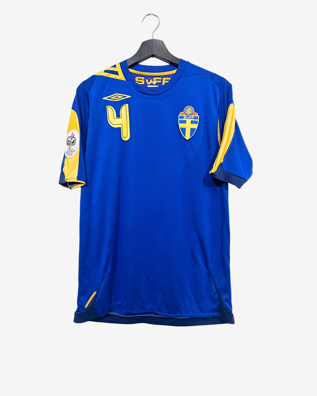 Blue sports jersey with yellow accents on a hanger against a white background