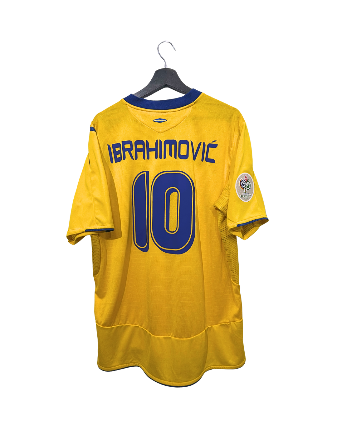 Yellow sports jersey with blue lettering and number on a hanger against a white background