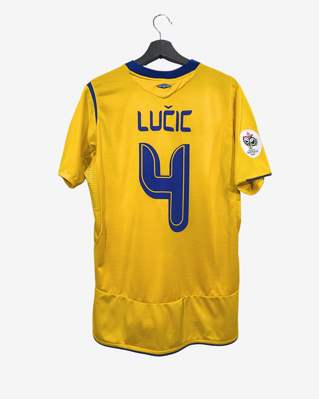 Yellow sports jersey with blue accents, featuring the name 'Lucic' and number '4', on a hanger against a white background.