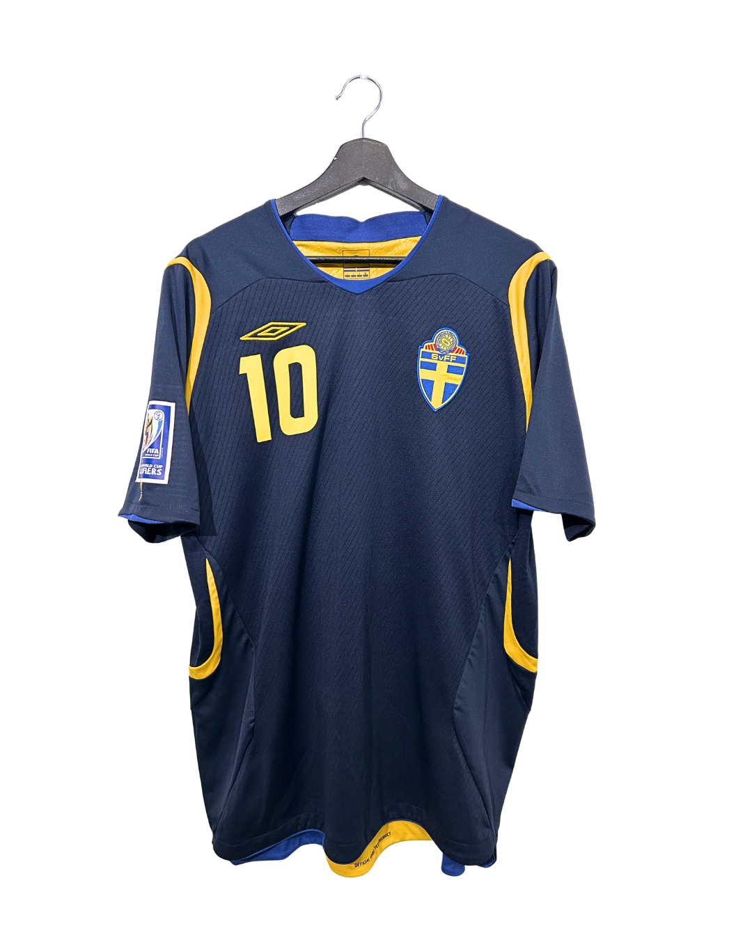 Blue sports jersey with yellow accents on a hanger against a white background