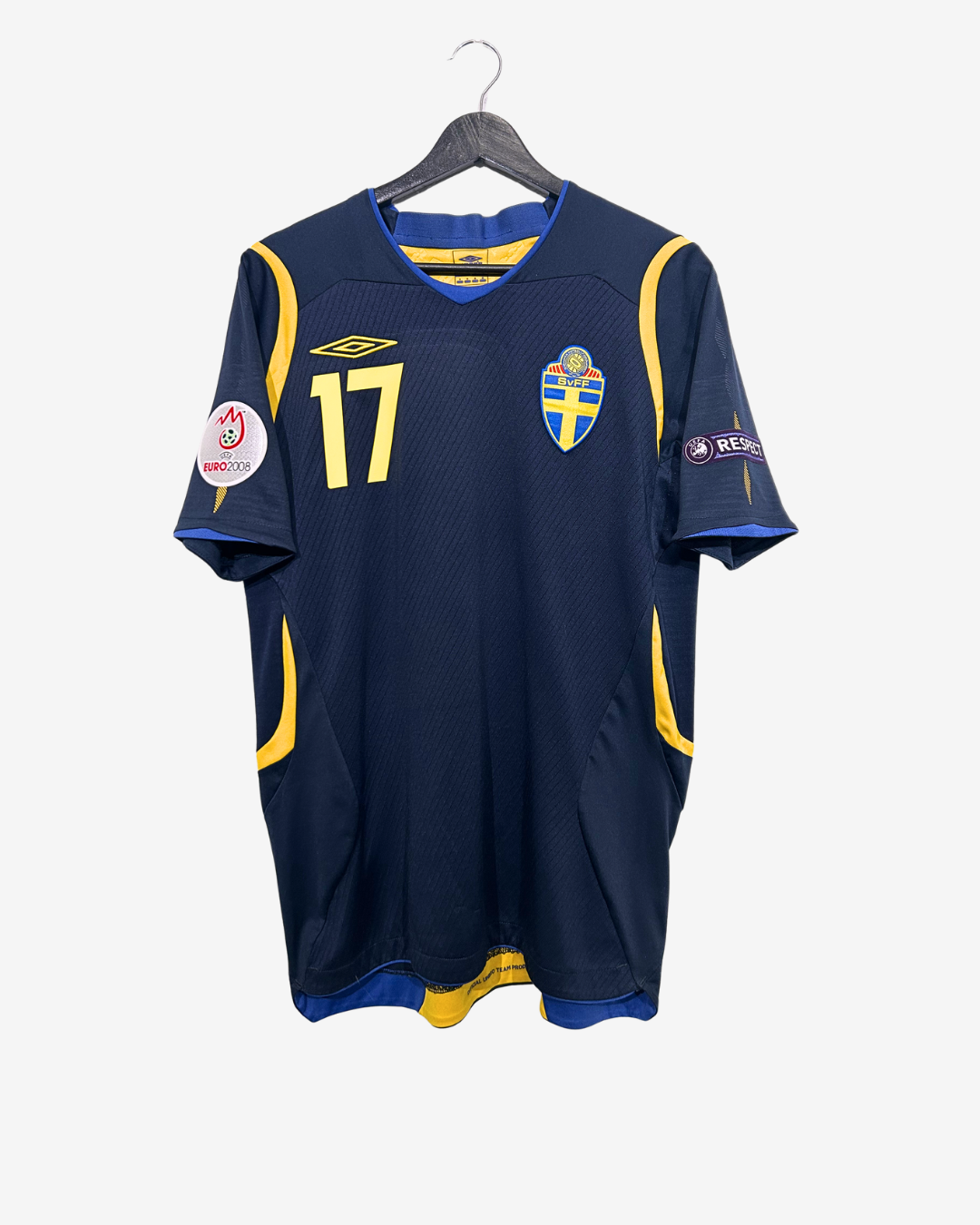 Navy blue sports jersey with yellow accents on a hanger against a white background