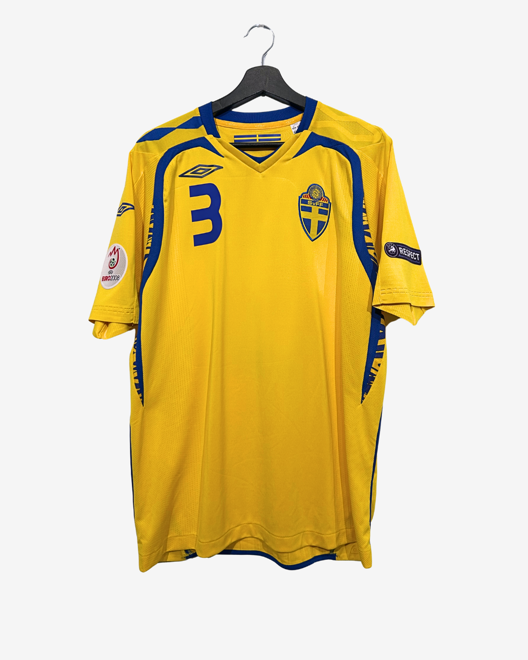Yellow sports jersey with blue accents on a hanger against a white background