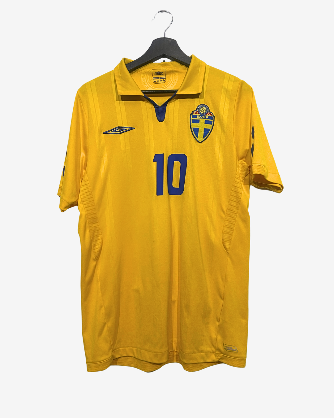 Yellow sports jersey with number 10 and logo on a hanger against a white background