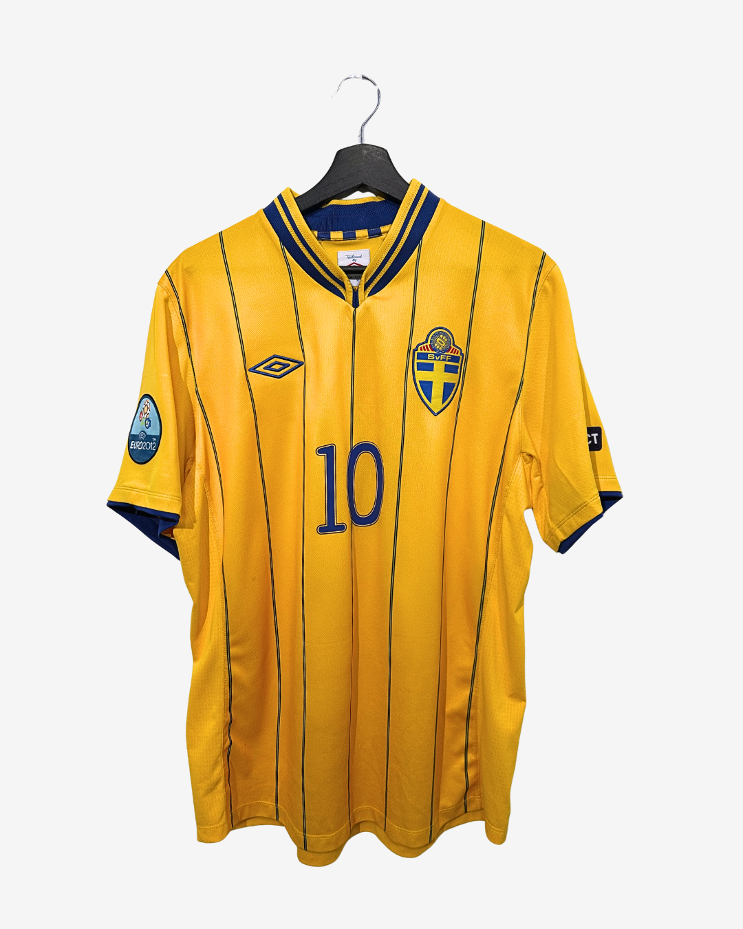 Yellow sports jersey with number 10 on a hanger against a white background