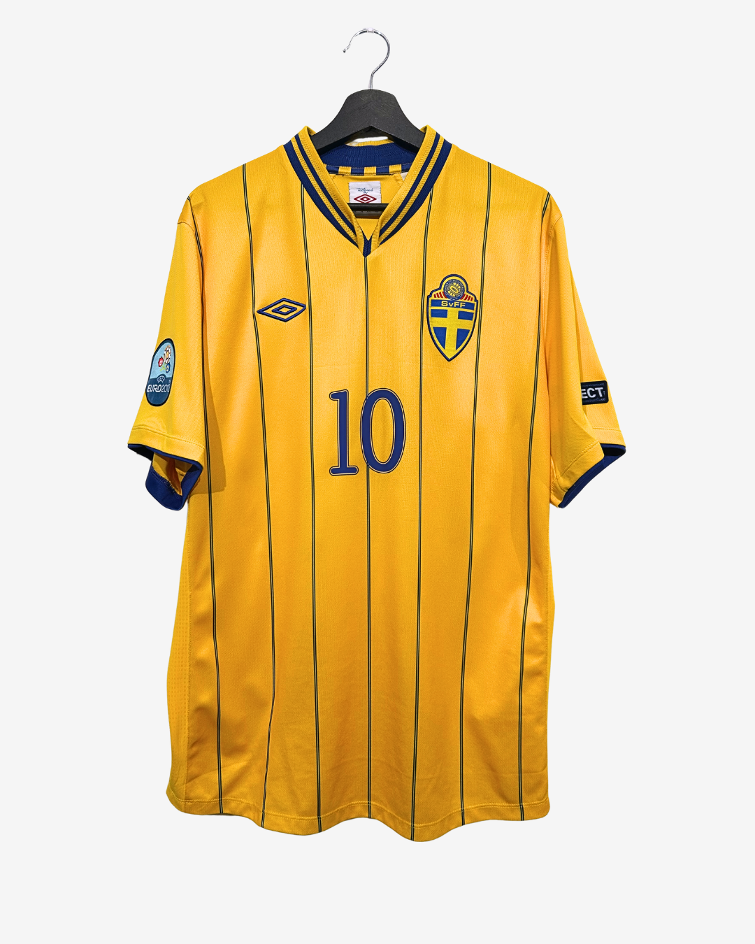 Yellow sports jersey with number 10 on a hanger against a white background