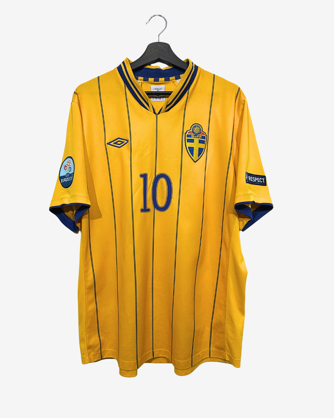 Yellow sports jersey with blue accents on a hanger against a white background