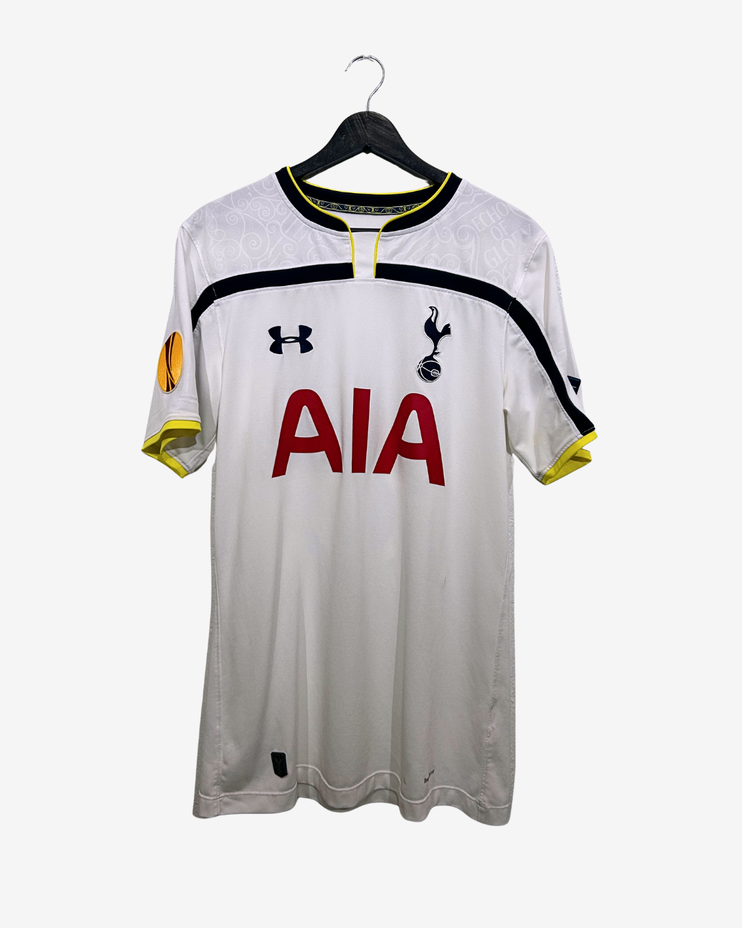 White sports jersey with red 'AIA' logo on a hanger against a white background