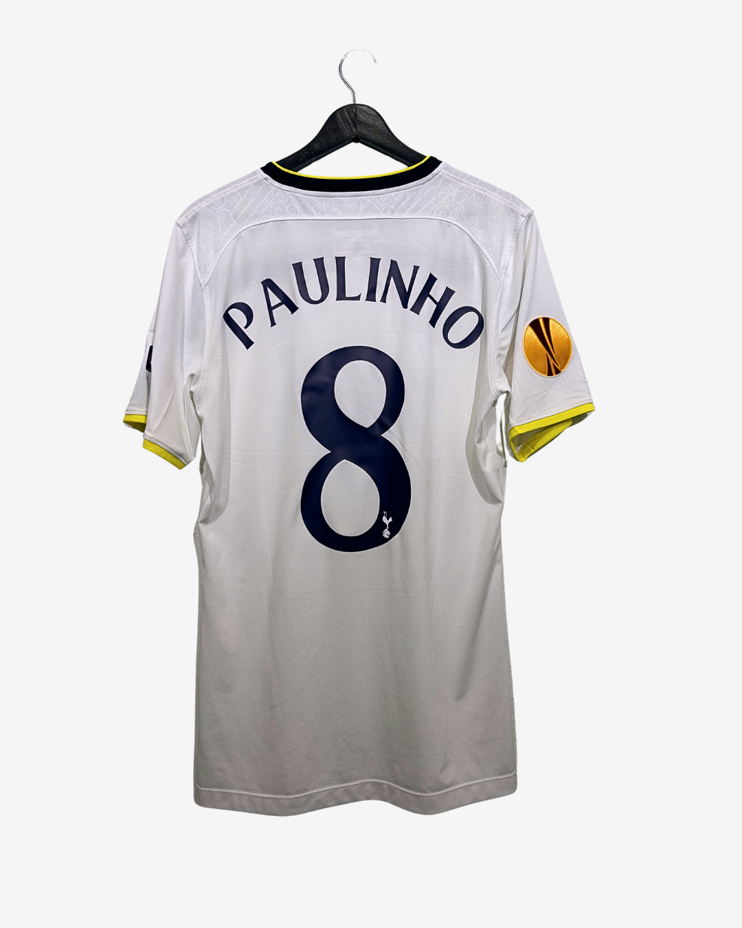 White sports jersey with 'PAULINHO 8' printed on a hanger against a white background